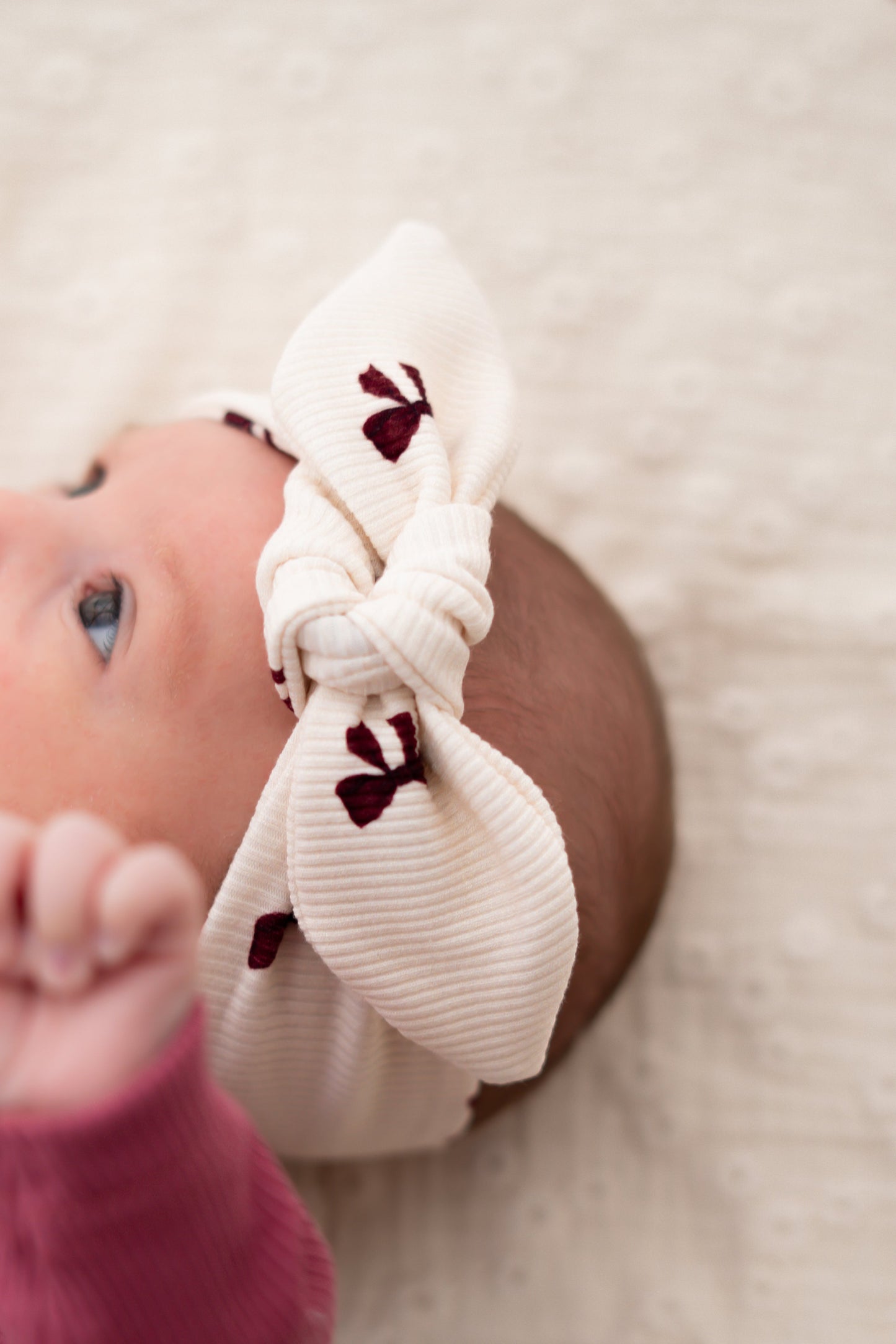 Haarbandje knoop Strikjes roze (rib)
